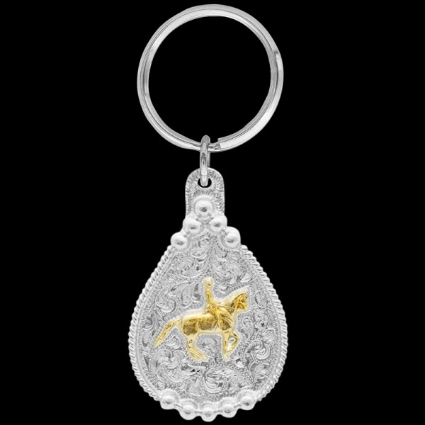 Elevate your equestrian elegance with our Gold Dressage Rider Keychain. Finely detailed, it's an essential accessory for riders and enthusiasts of the classical discipline. Explore now and add a touch of grace and sophistication to your keychain collectio